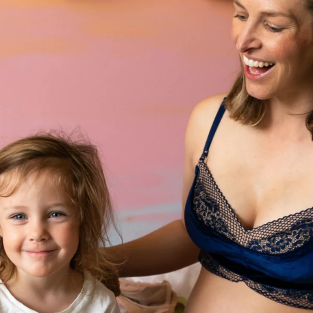 jolie ink pumping bra image from the front, woman with child
