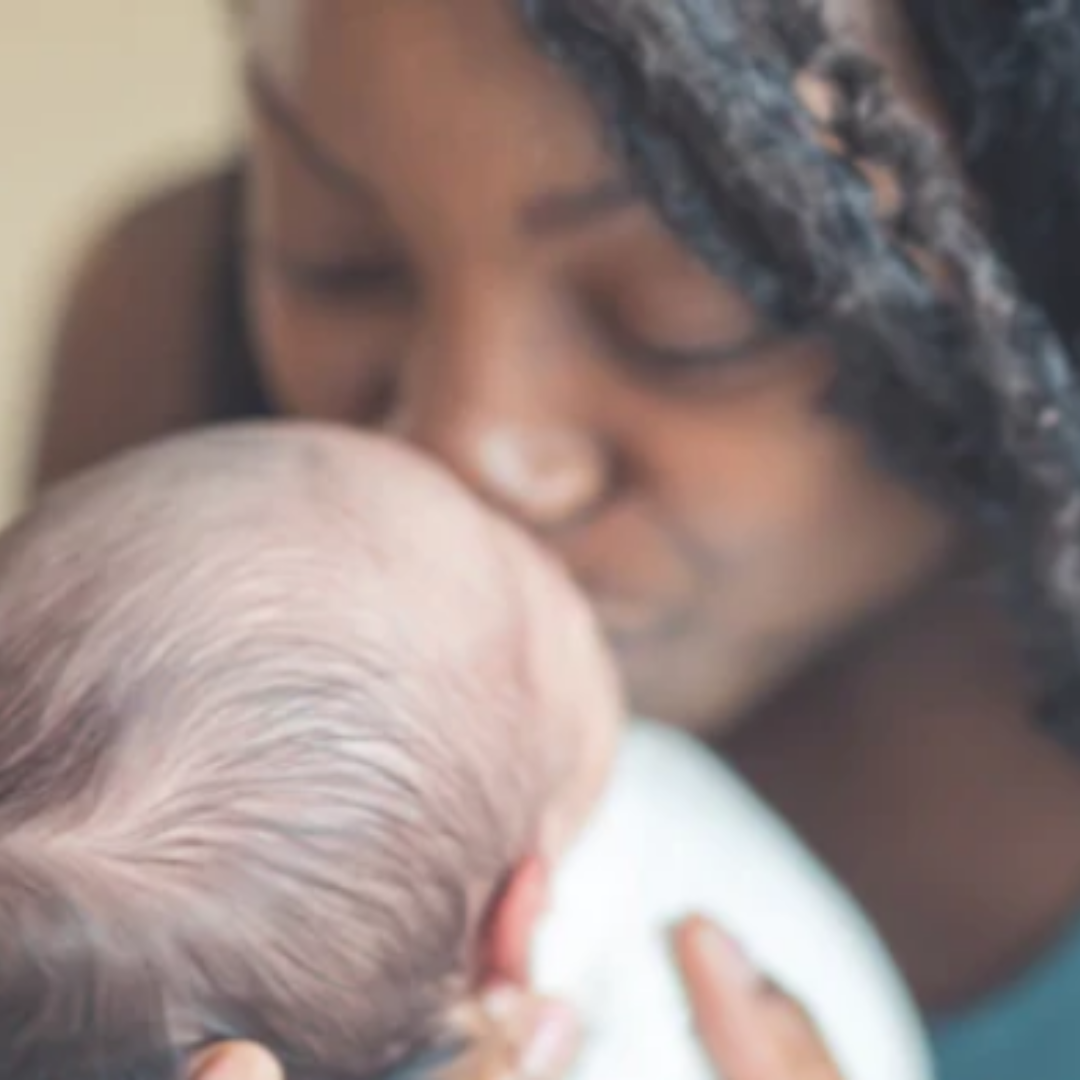 mom kissing baby, childhoold, motherhood