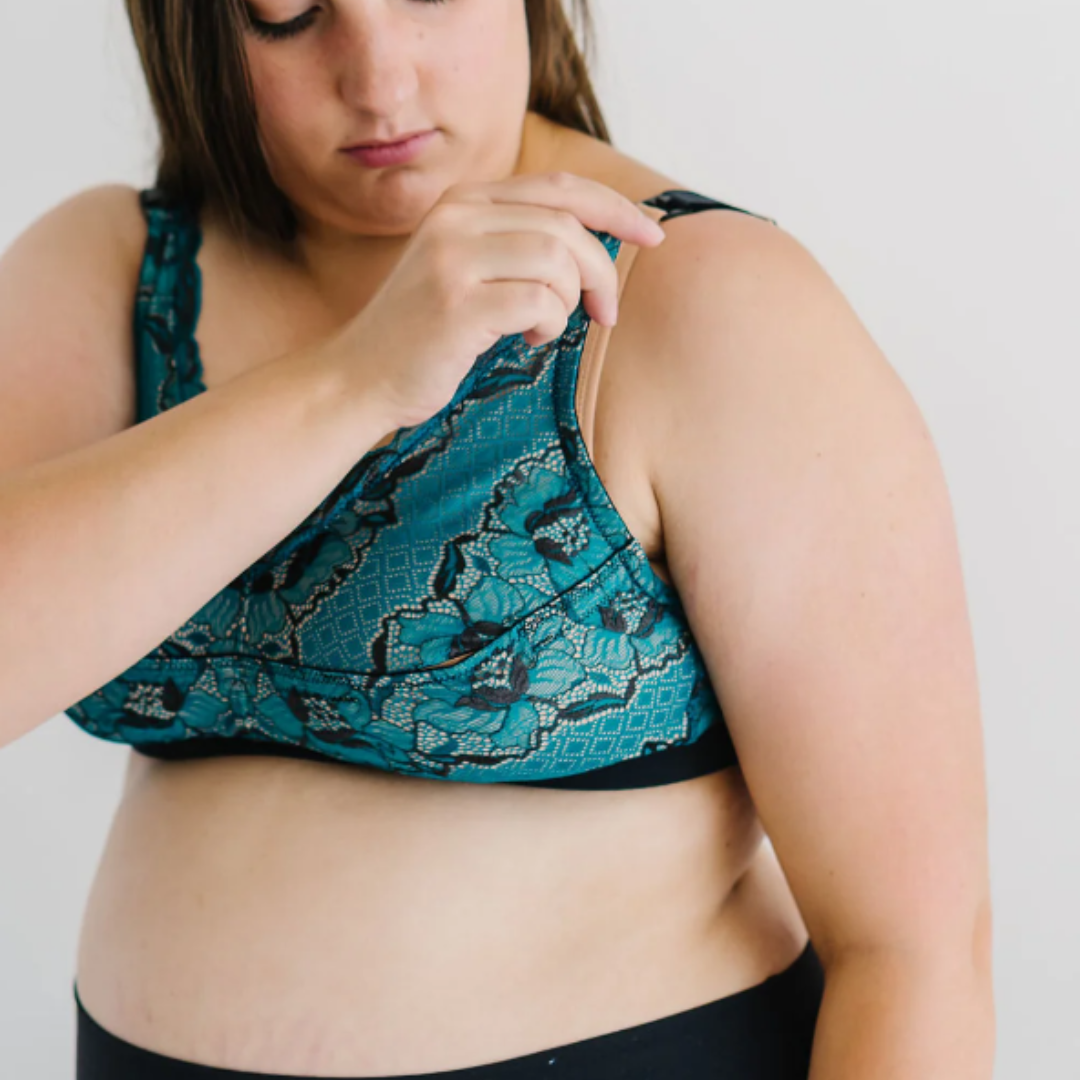ruby plus teal pumping bra image from the front, woman lounging