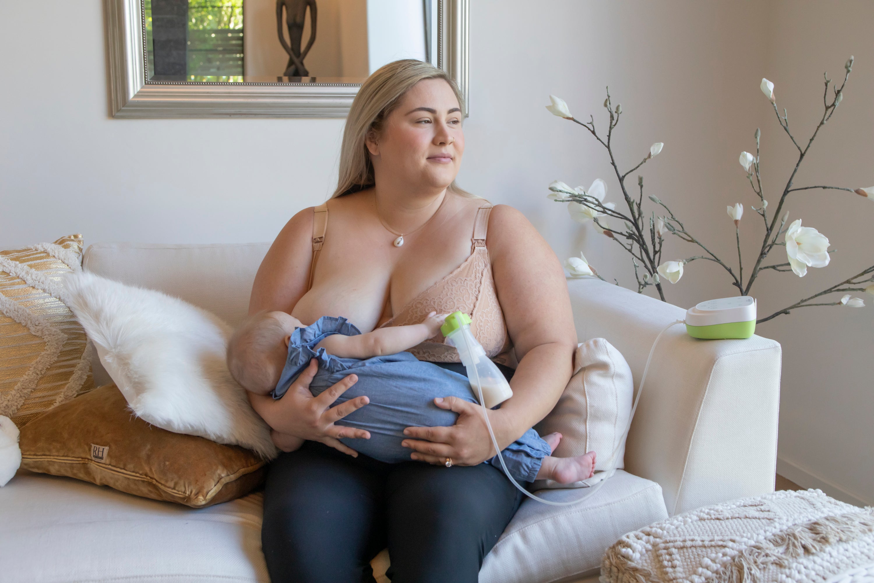 Mom nursing and pumping with baby
