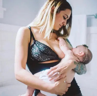 Naked tank black image from the front, woman nursing