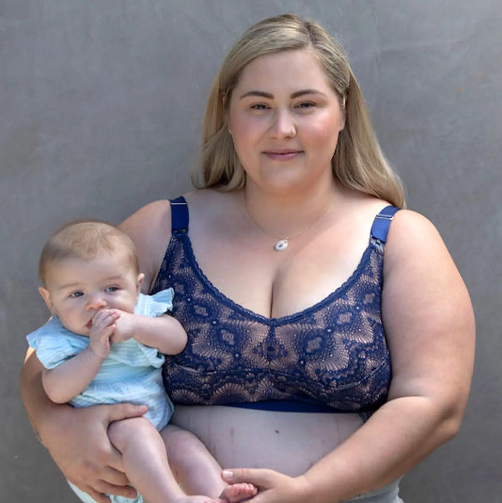 Ruby ink plus pumping bra image from the front, mom with baby