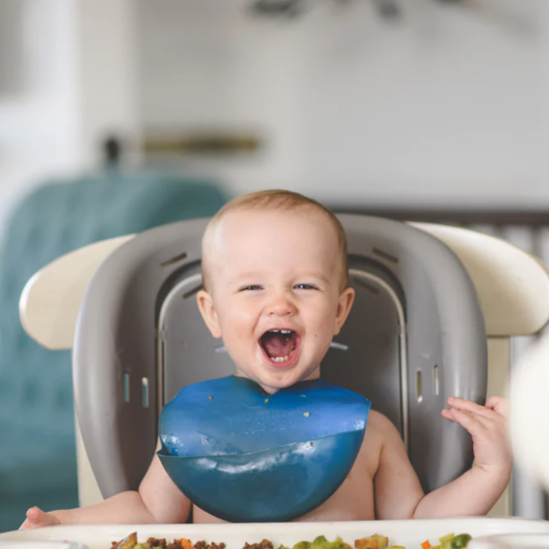 baby laughing and eating, baby smiling