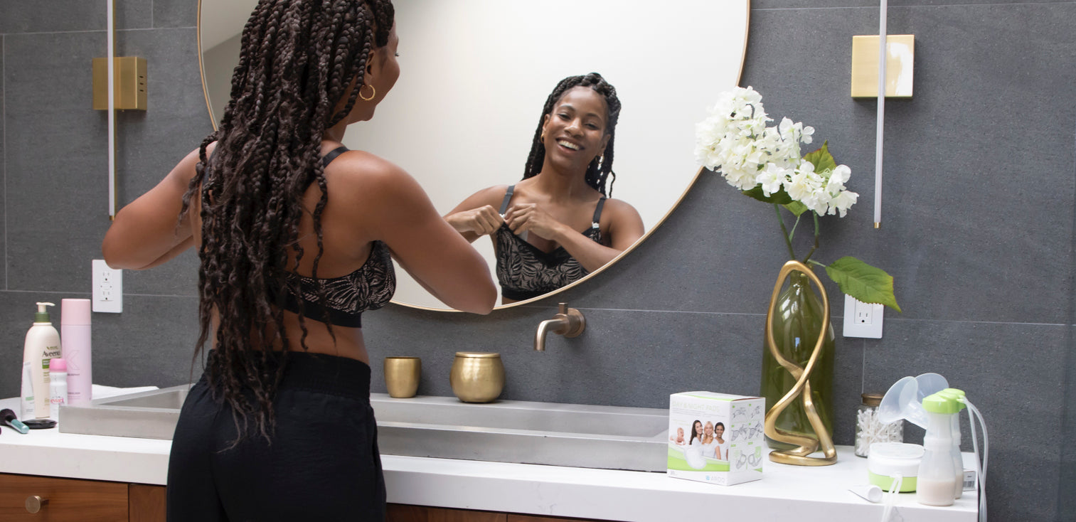 MOM looking in mirror with bra and breastpads